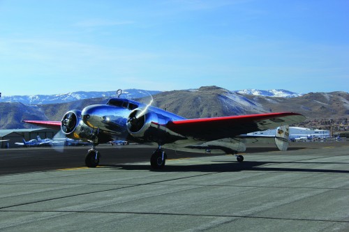 Image: CLICK FOR HI-RES, from Museum of Flight. Press Release: On March 9, 2013, aviator and adventurer Dottie Simpson announced that The Museum of Flight will add a uniquely restored, antique Lockheed Model 10-E aircraft to its collection. This is the same type of plane Amelia Earhart was flying on her ill-fated attempt to fly around the world in 1937. The aircraft will be flown to the Museum during late summer 2013 and become the centerpiece of a new exhibit honoring Earhart. The Museum already owns the only known piece of Earhart"s Electra. This artifact and the airplane will help tell the story of the world"s most famous women aviator in ways that cannot be found in any other museum. The Museum"s Electra In the late summer of 2012, The Museum of Flight launched a now-successful fundraising campaign to acquire an Electra. The aircraft the Museum has taken ownership of has had many different owners, designations and exterior color schemes. Let"s take a quick look at its 78-year history. The Electra was built as a Model 10-A and registered as NC14900. The 15th Electra built by Lockheed, NC14900 was delivered in 1935 to Northwest Airlines, the first airline to put the Electra into service. After the attack on Pearl Harbor, NC14900 was ”drafted" into the U.S. Army Air Forces, along with many other Electras. Redesignated a UC-36A, painted camouflage and given the USAAF serial number 42-57213, it spent a short time as a VIP transport. Once more military transport aircraft became available, 42-57213 was returned to Northwest in May 1944 and was once again known as NC14900. After the war ended and larger DC-3s were available in surplus, NC14900 was sold to VARIG, the first Brazilian airline and registered PP-VAR. The aircraft also saw brief military service in Brazil, as part of the Brazilian Air Force (and known at this time as FAB-1002.) Once back in the United States, the aircraft saw many private owners as N2067A before it was returned to Lockheed and completely converted to a Model 10-E configuration. It was then registered as N72GT. In 1994, aviatrix Linda Finch happened upon N72GT, which was one of only two airworthy 10-Es. With the assistance of Pratt & Whitney, the manufacturer of the original engines, and using original Lockheed drawings and vintage photographs, Finch restored the aircraft to the specifications of the most famous Lockheed 10-E the world has ever seen…Amelia Earhart"s. From rivets to the exterior color scheme, and even the historical registration of NR16020 worn on Earhart"s aircraft, Finch faithfully restored the plane. But Finch didn"t just recreate the look of Earhart"s aircraftshe also reenacted Earhart"s flight plan. In 1997, the 60th anniversary of Earhart"s flight, Finch took off. She flew as close to Earhart"s original flight plan as possible (she was unable to fly over Libya and made more stops than on Earhart"s flight plan while crossing the Pacific) and in all, she touched five continents on the journey. While flying over Howland Island, which was to be Earhart"s final destination, Finch dropped a wreath in salute of Earhart and her navigator Fred Noonan. Among the thousands of items in the Museum"s collection is a piece of crumpled metal approximately 4 inches by 5-and-a-half inches in size, which could be easily passed over by the casual observer. Yet this scrap of aluminum holds a significant place in aviation historyit is the only known piece remaining of Amelia Earhart"s Lockheed 10-E Electra. Quick facts about the Lockheed Electra: The Lockheed Model 10 Electra was famed engineer Clarence ”Kelly" Johnson"s first assignment with the Lockheed Aircraft Corporation. Then a lab assistant at the University of Michigan, Johnson was asked to redesign the aircraft"s tail surfaces after identifying stability issues during wind-tunnel tests. Only 149 Model 10 airplanes were constructed, with four commercial series (10-A, 10-B, 10-C and 10-E) and five military versions (XR2O-1, XR3O-1, XC-35, Y1C-36 and Y1C-37.) The Electra was Lockheed"s response to the Douglas DC-2 and the Boeing 247, which had revolutionized commercial airline service in the United States. The Model 10 was both fast (190 mph) and comfortable for passengers.