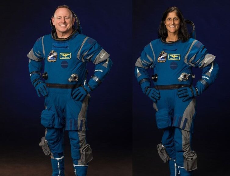 astronauts pose in their flight suits