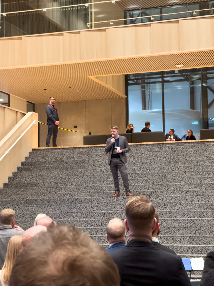 Icelandair President and CEO Bogi Nils Bogason addresses a gathering at the airline's new headquarters building